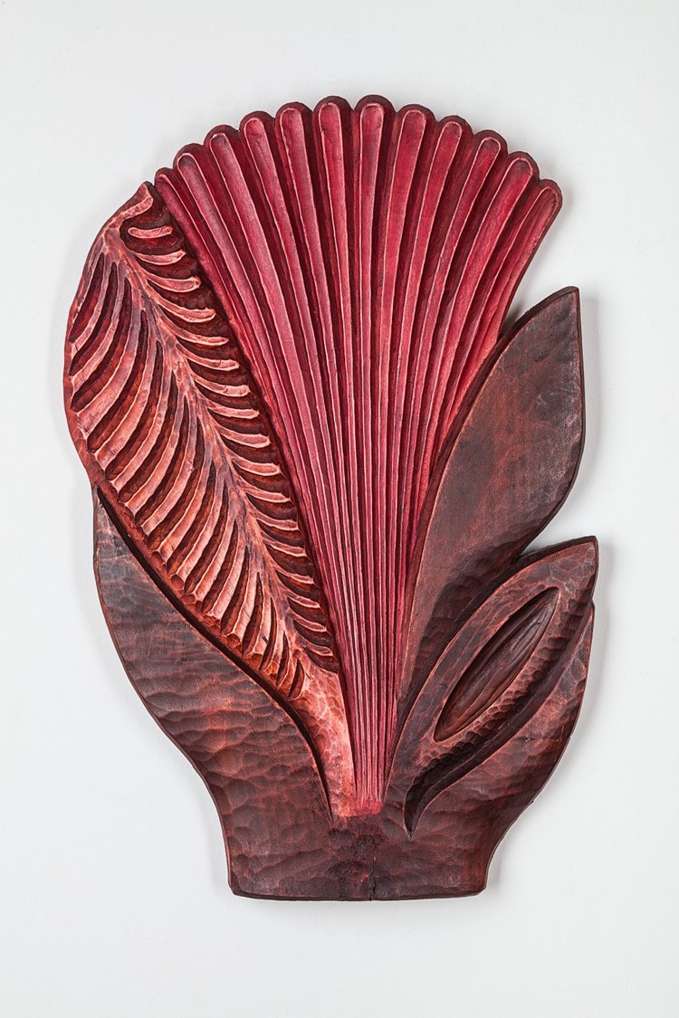 image of a carving in wood representing a flower